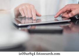 Hand of business person using digital tablet