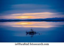 Reflection pool of horizon over water, blue evening sky and sunset, Bonneville, Utah, USA