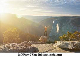 Hiker rejoicing on hill, Yosemite National Park, Sierra Nevada