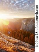 Hiker rejoicing on hill, Yosemite National Park, Sierra Nevada