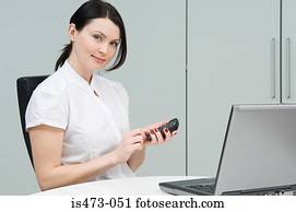 Woman using calculator