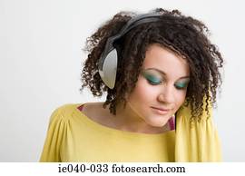 Teenage girl listening to music