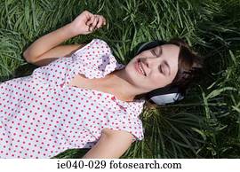 Teenage girl listening to music