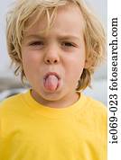 Boy sticking out tongue