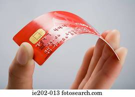 A person holding a credit card
