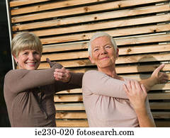 Senior women doing tai chi Senior women doing tai chi