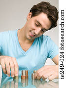 Man stacking coins