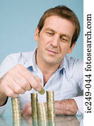 Man with stacks of pounds