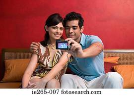 A couple photographing themselves