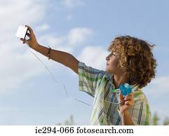 Boy using a small solar panel
