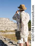 Man photographing ruins