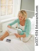 Woman with paper and calculator