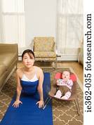 A mother practising yoga