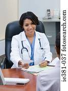 A doctor handing a patient a prescription