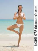 A young woman practising yoga