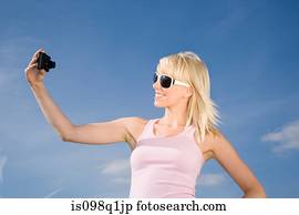 Woman photographing herself