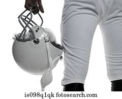 American football player holding a helmet