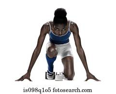 Young woman at starting blocks