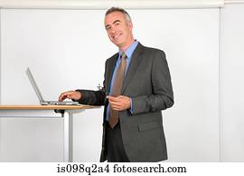 Portrait of a lecturer using a laptop