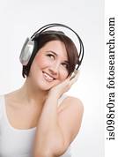 A teenage girl listening to music