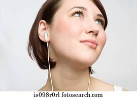 Teenage girl listening to music