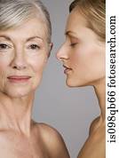 Faces of young and senior women Faces of young and senior women