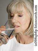 Senior woman drinking water