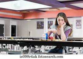 Girl alone at lunch