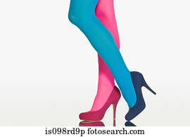 Woman with contrasting tights and shoes