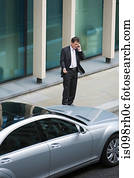 Businessman using a cellular telephone