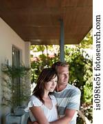 Couple outside house