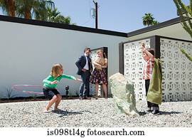 Family playing outside home