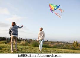 Young couple flying a kite