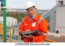 Engineer with handheld computer