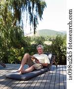 Senior man on sun lounger