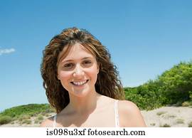 Young woman with long brown hair, portrait