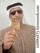 Middle eastern man holding credit card