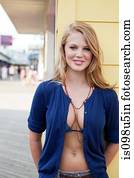 Teenage girl in bikini top and cardigan