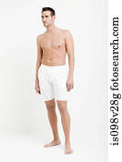 Portrait of young man wearing white boxer shorts