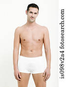 Portrait of young man wearing white boxer shorts
