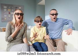 Family watching 3d movie at home