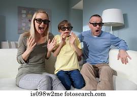 Family watching 3d movie at home