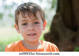 Boy wearing orange t shirt, portrait