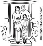 A family standing in front of their home