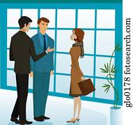 A man introducing a businessman to a businesswoman