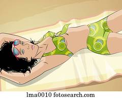 A woman sunbathing on the beach