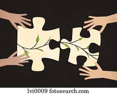 Two people completing a jigsaw puzzle