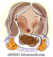 A woman with a plate of fresh baked cookies