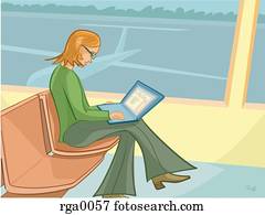 A businesswoman working while waiting for her flight at an airport A businesswoman working while waiting for her flight at an airport