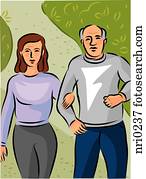 An elderly couple walking hand in hand along a path in the park